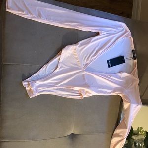 Nastygal size US 4 deep V neck body. NWT